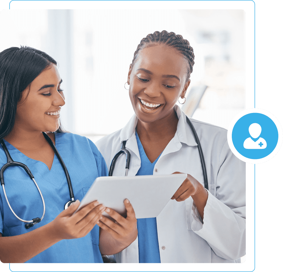 Doctors discussing patient information on tablet.