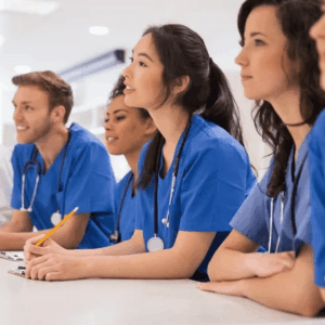 A group of medical professionals attentively listening during a session.